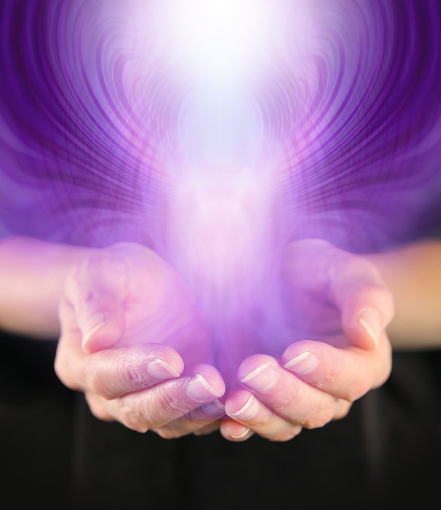 Cupped hands with violet energy rising upward